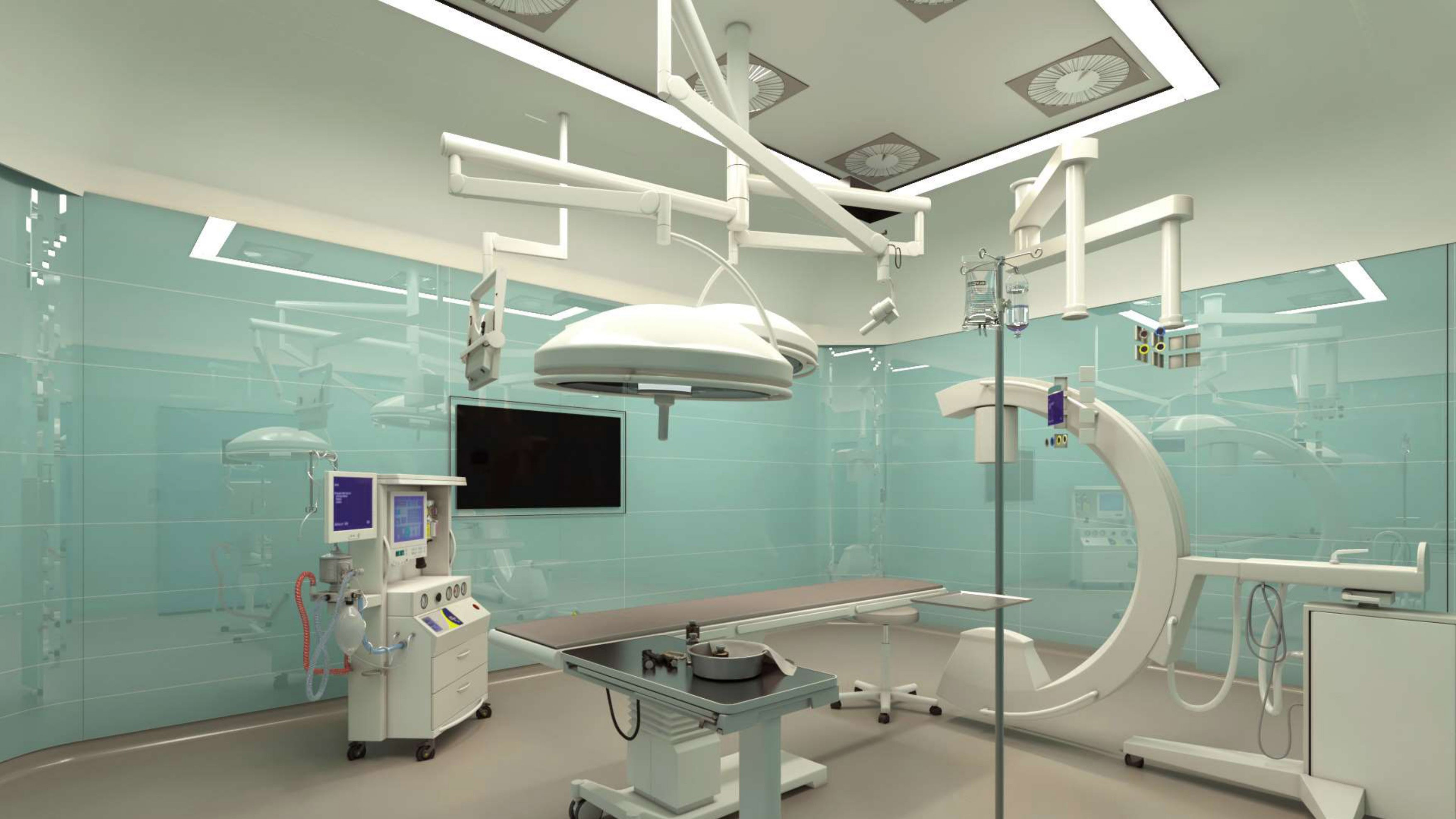 Modern operating room at Medicana Ataköy Hospital with surgical table, imaging equipment and ceiling-mounted lights.