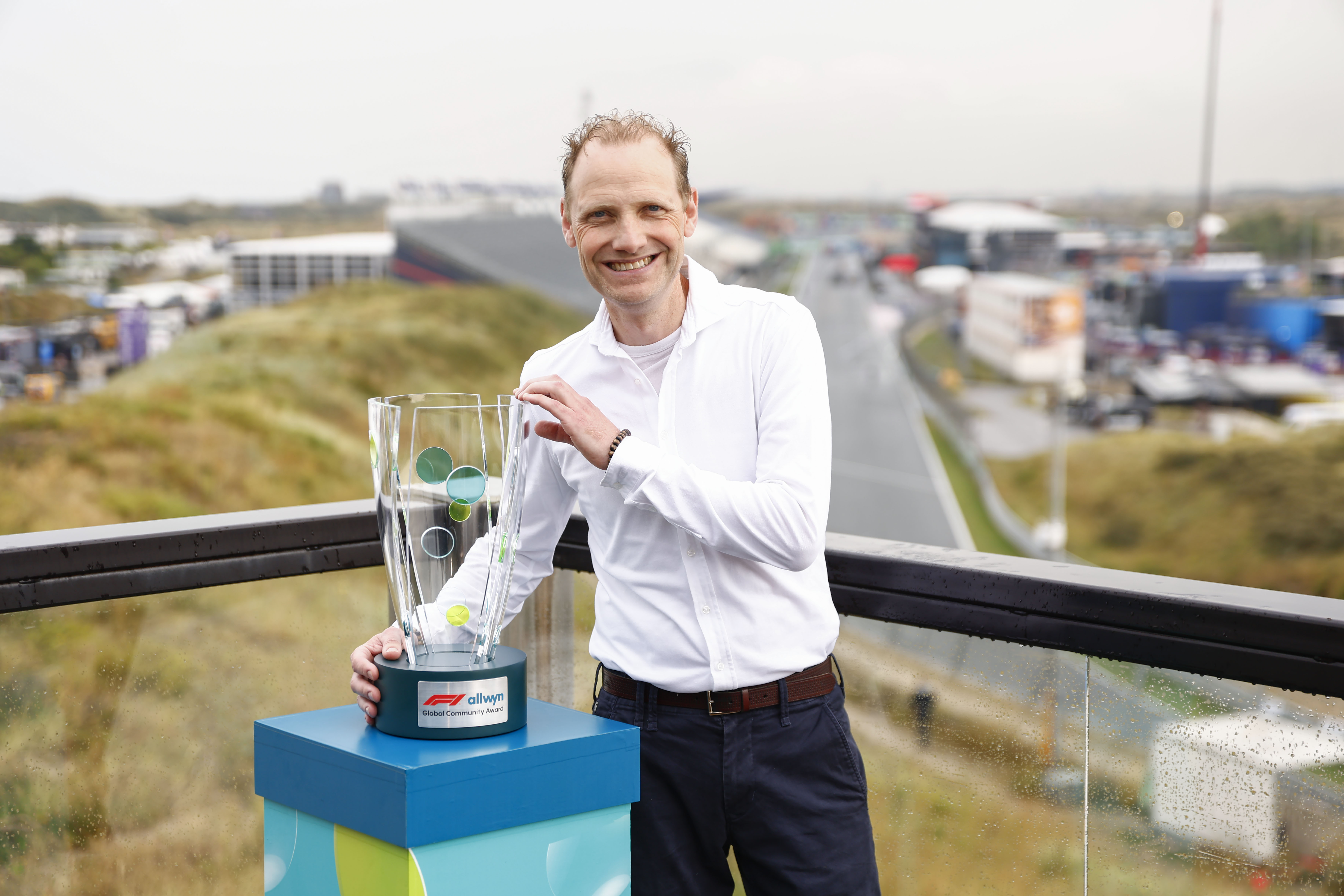 First F1® Allwyn Global Community Award trophy awarded to Jan Willem Koopman from winning local community initiative Stichting HandicapNL at the Formula 1® Heineken Dutch Grand Prix track in Zandvoort, Netherlands.