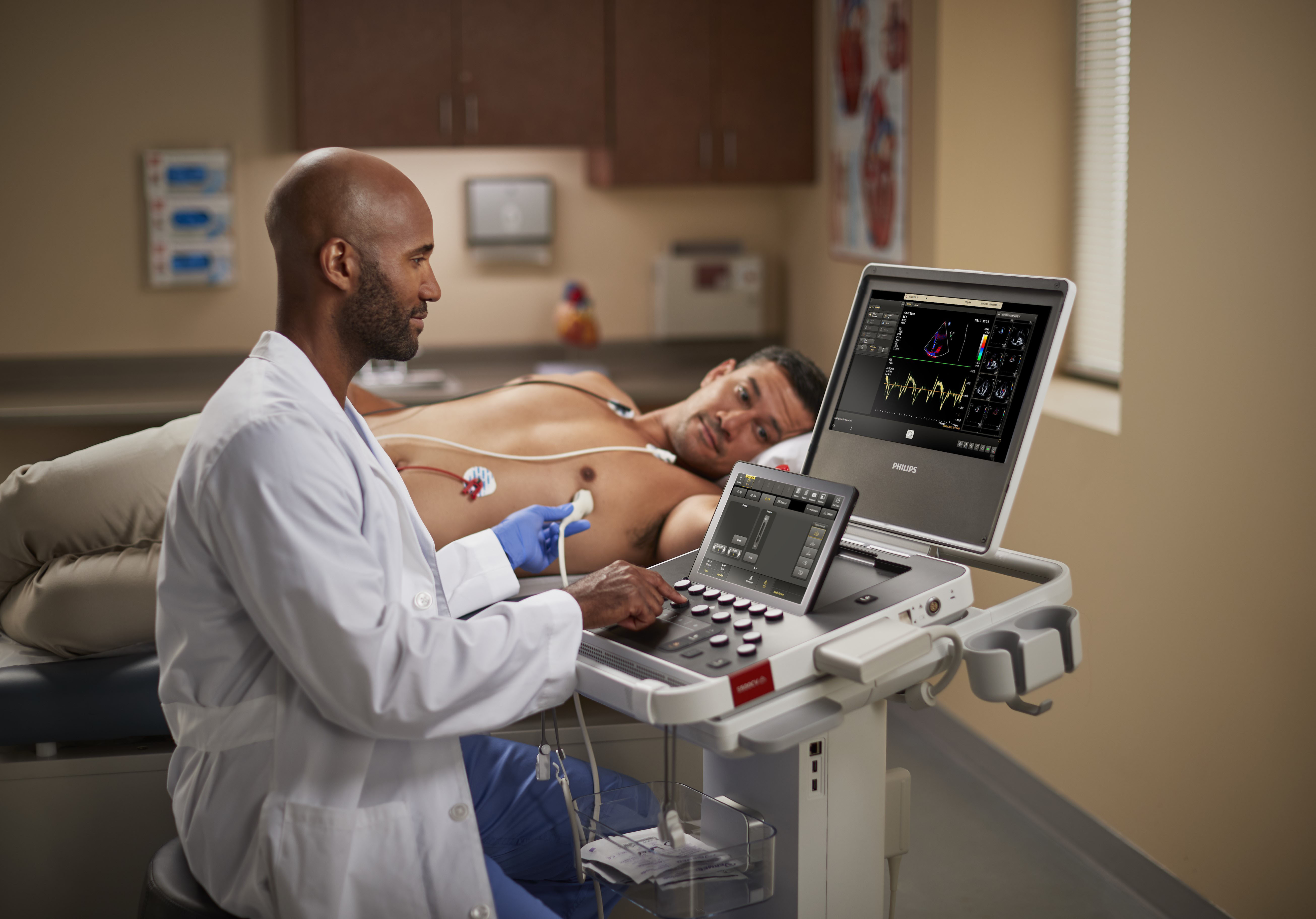 A clinician with Compact Ultrasound 5500CV and patient