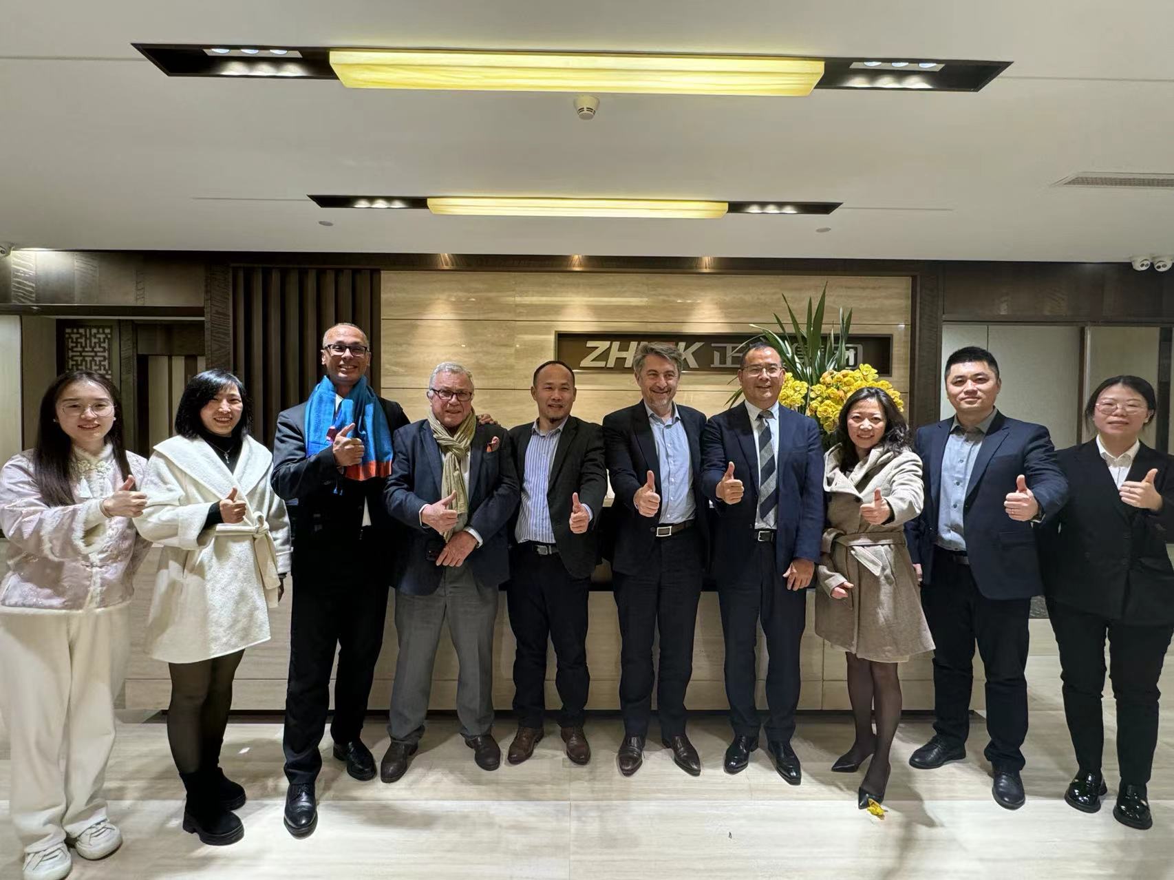 Emmanuel Ladent, CEO, CARBIOS (fifth from right) and Zhu GuoYang, President of Zhink Group (fourth from right) surrounded by their teams at Zhink Group’s Headquarters in Hangzhou, China