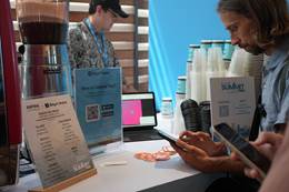 A person looking at a phone  AI-generated content may be incorrect.
