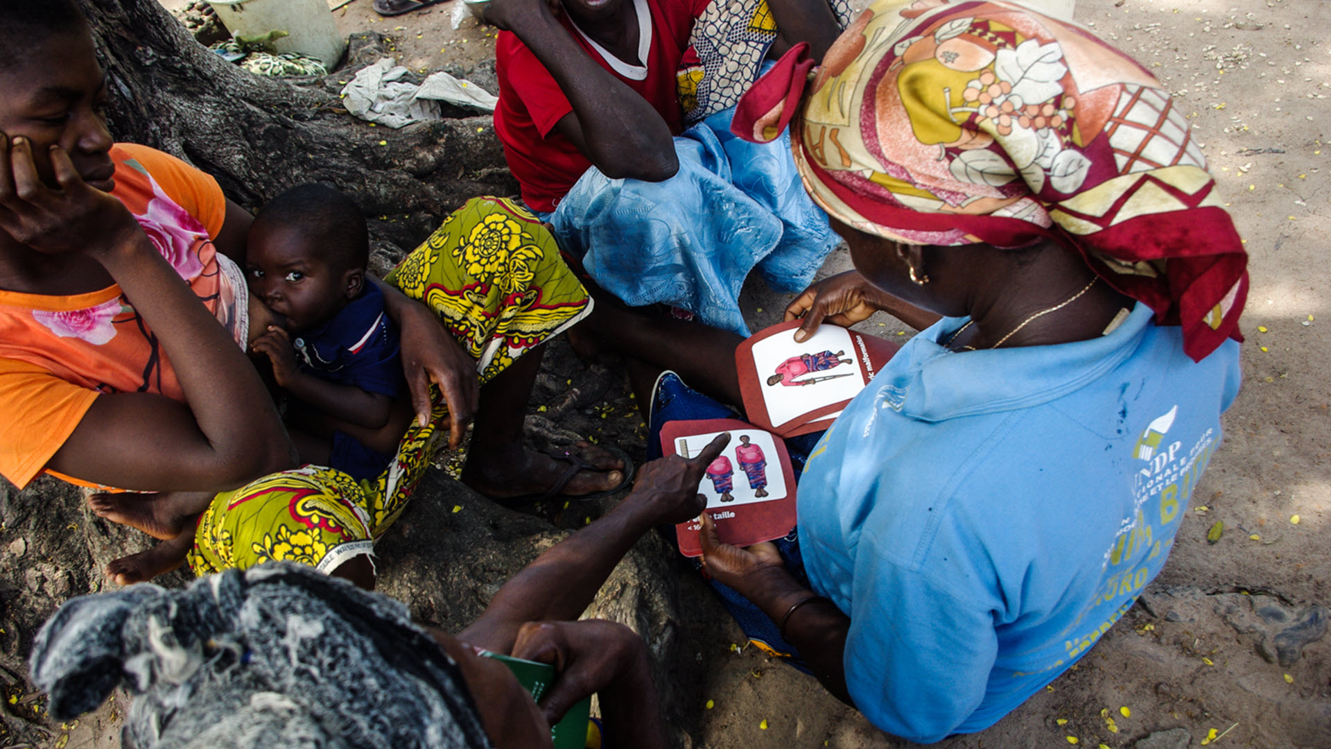 Easy-to-understand referral cards being reviewed by mothers