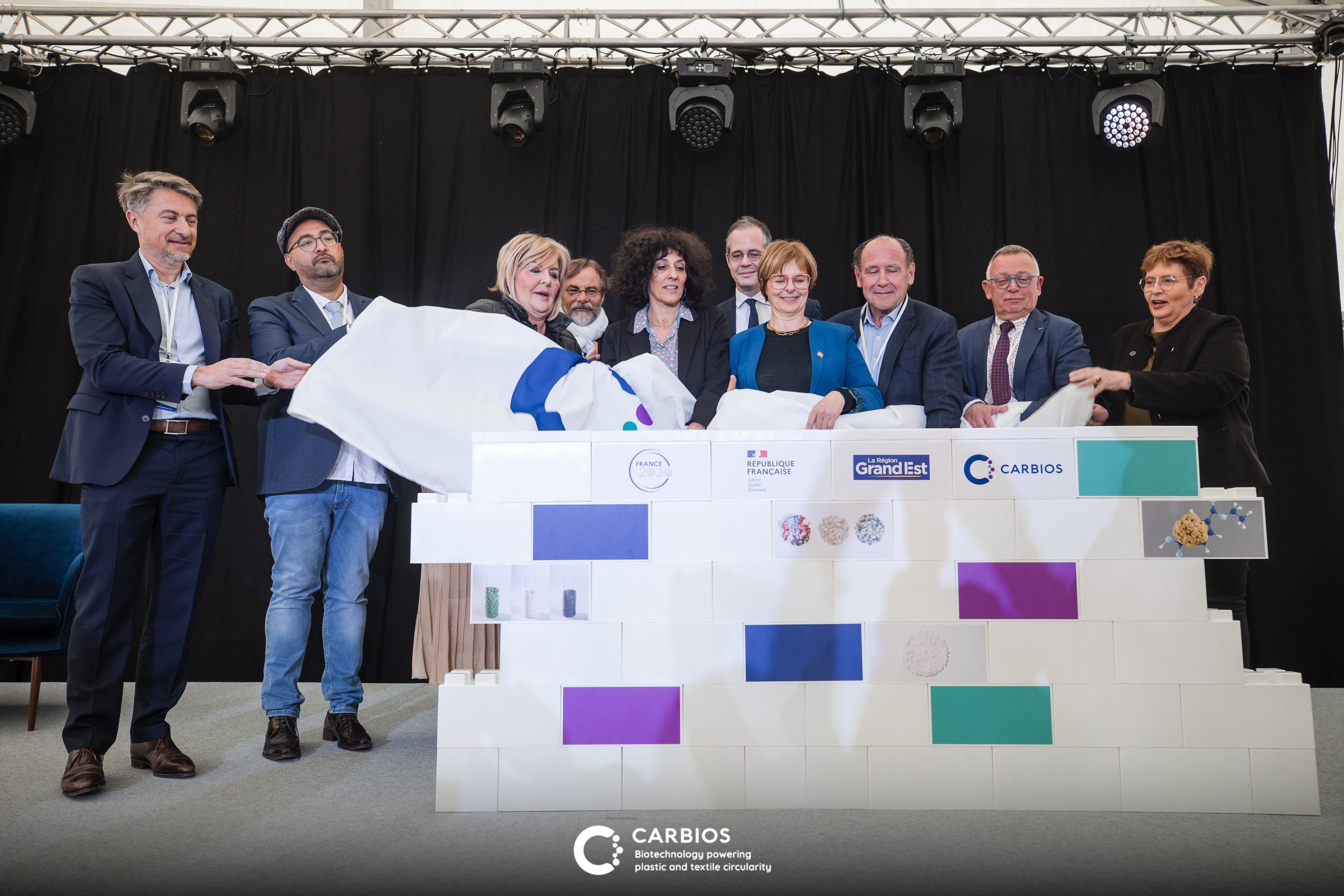 (from left to right): Emmanuel Ladent, CEO of CARBIOS; Hamdi TOUDMA, Mayor of Longlaville; Françoise SOULIMAN, Prefect of Meurthe-et-Moselle; Richard-Daniel BOISSON, Sub-prefect of Val-de-Briey; Chaynesse KHIROUNI, President of the Meurthe-et-Moselle Departmental Council; Mathieu Brandibat, SGPI Critical and Sustainable Materials Adviser; Véronique GUILLOTIN, Senator and Regional Councillor; Philippe Pouletty, Chairman of the Board of Directors of CARBIOS; Serge de CARLI, Chairman of the Longwy Conurbation; Martine ETIENNE, Member of Parliament