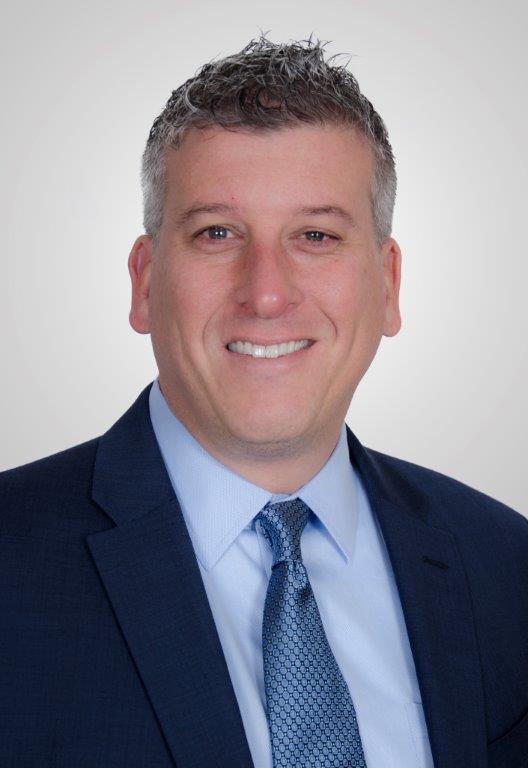 Headshot of Greg Sheehan, CEO of Calcivis