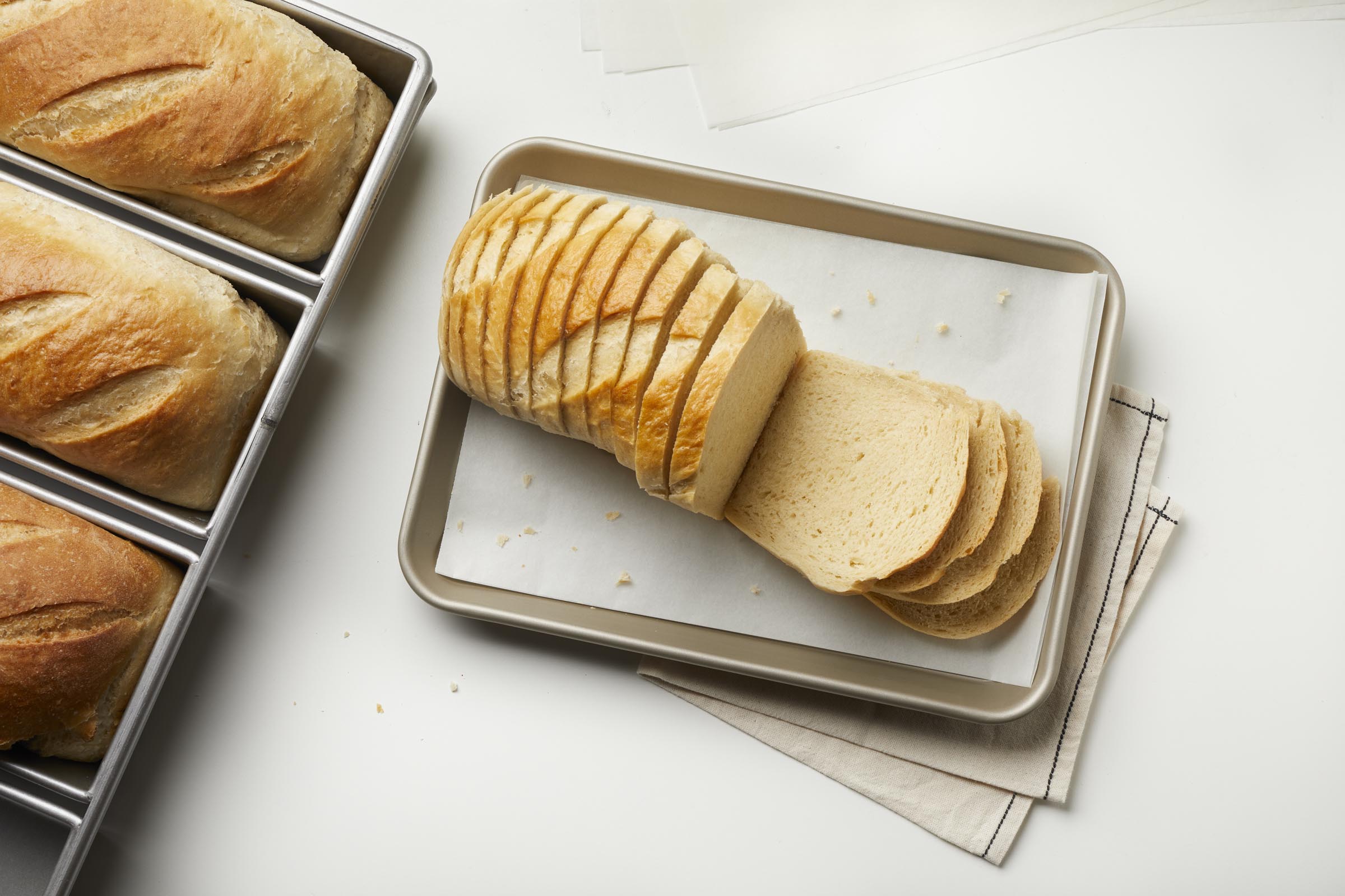 White loaf on industrial pan. 
