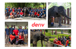 Deriv team at an elephant sanctuary with an elephant wearing a Deriv-branded prosthetic leg