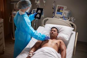 Man undergoing ultrasound in ED