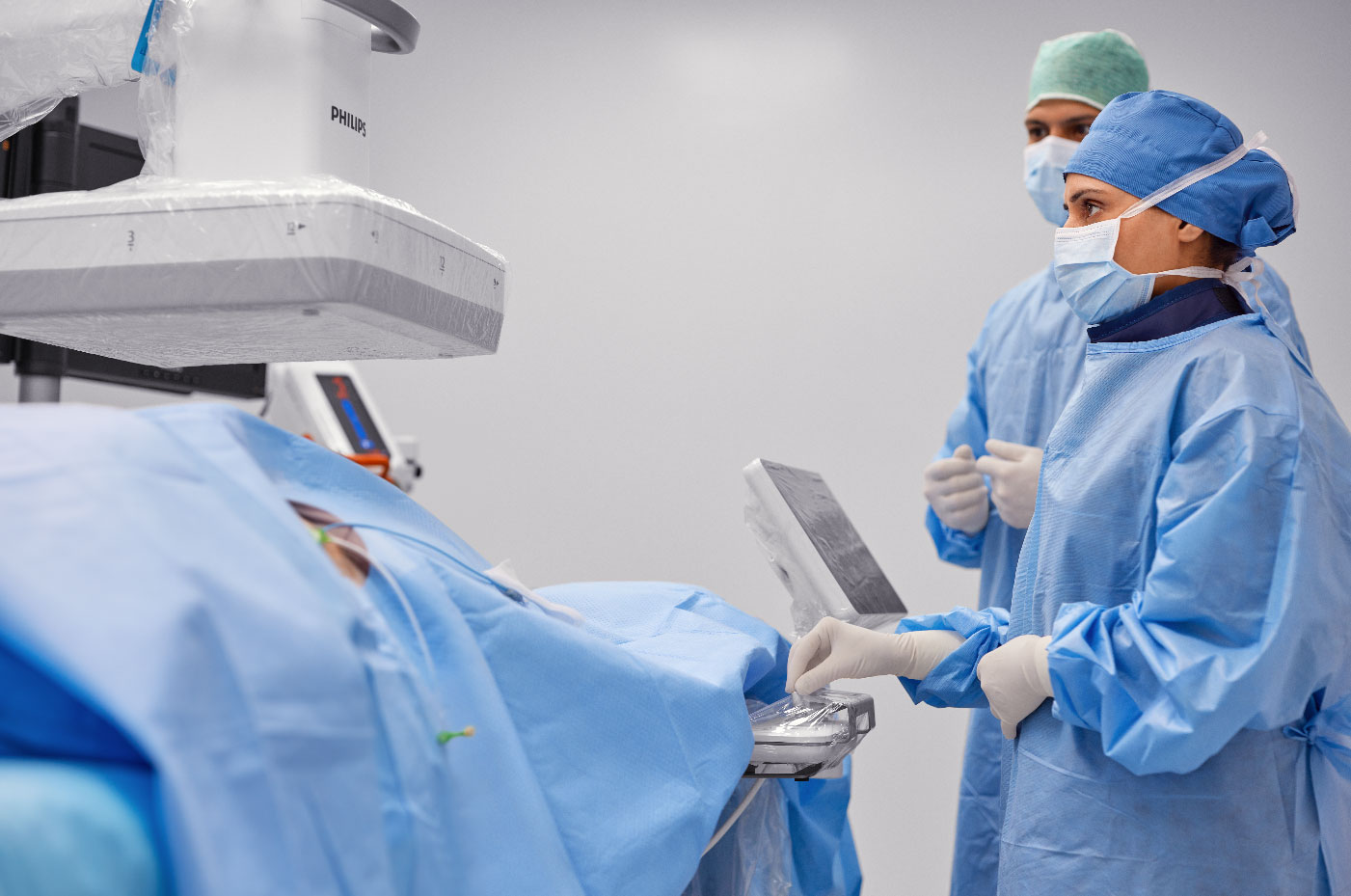 Physicians using the Zenition 90 Motorized mobile X-ray system during an intervention