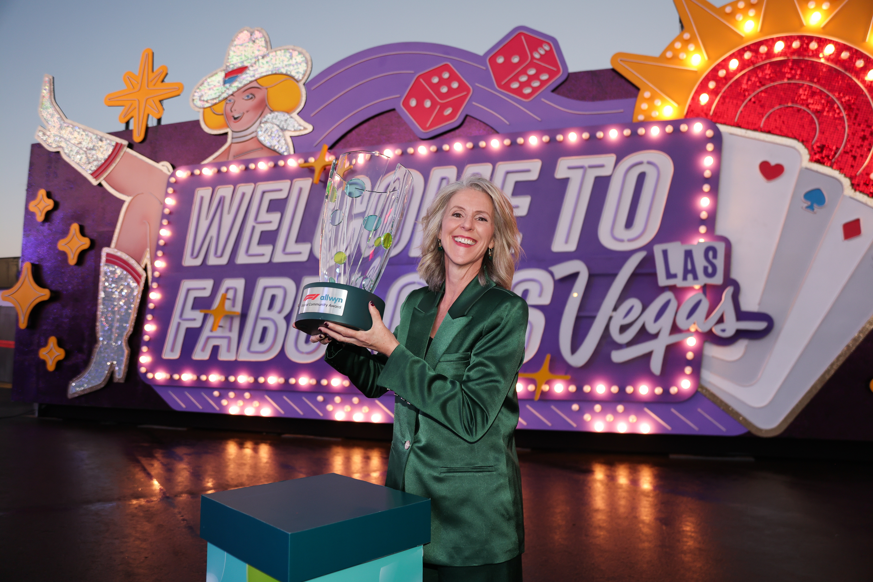 Ciara Byrne receives the F1® Allwyn Global Community Award in Las Vegas on behalf of winning initiative Green Our Planet ahead of the Formula 1® Heine