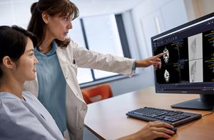 Radiologist reviewing scans