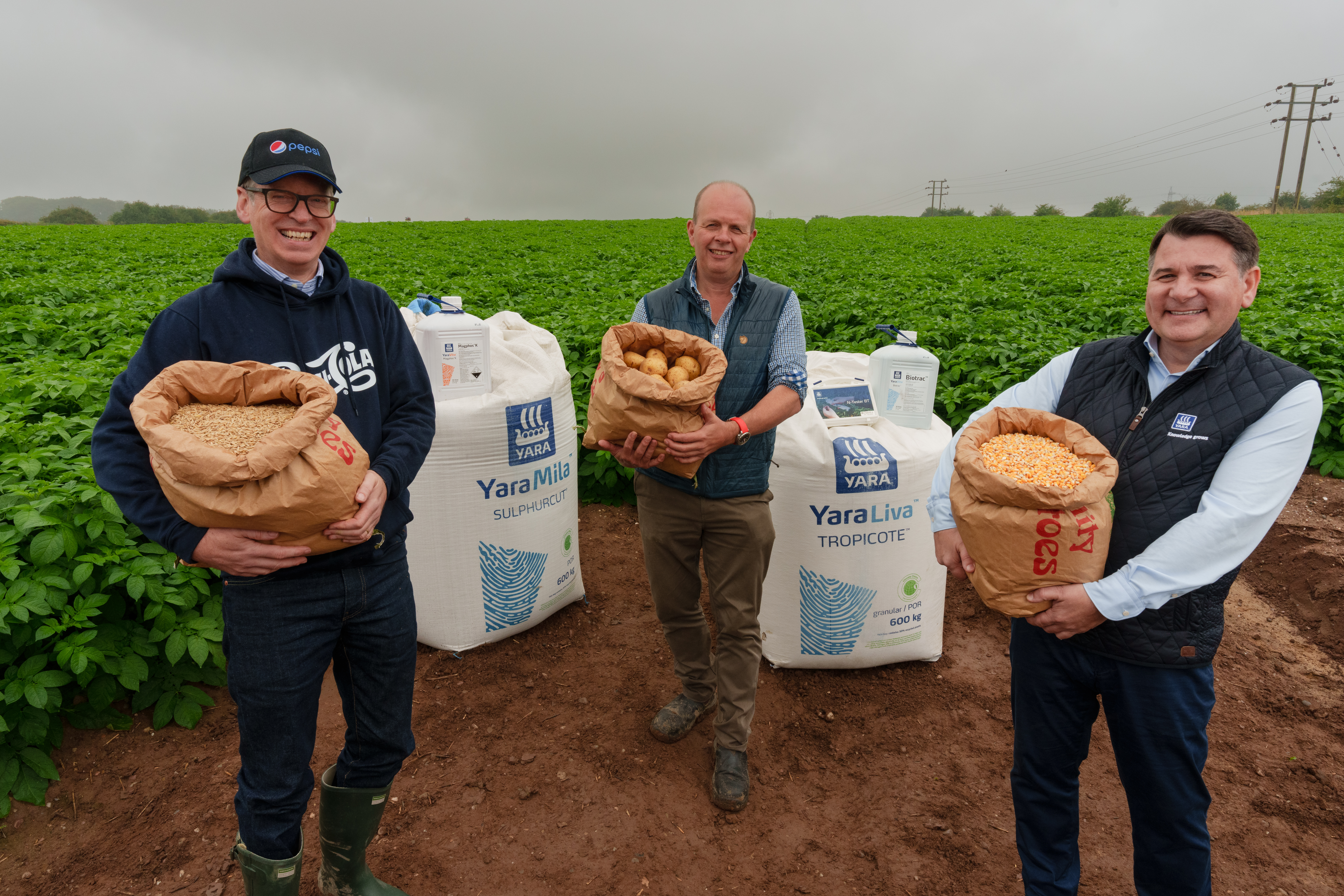 Representatives from Yara, PepsiCo and Strawsons Limited in a field