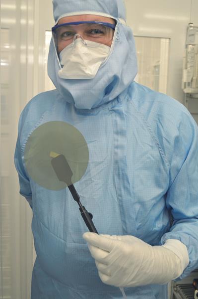 Soitec employee with Smart Cut-based SiC wafer