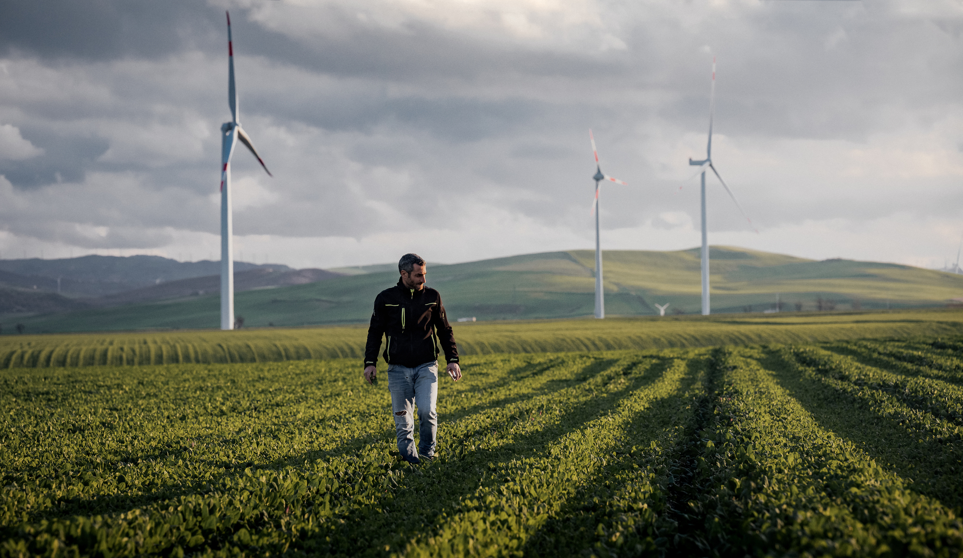 Farmer walking across a field